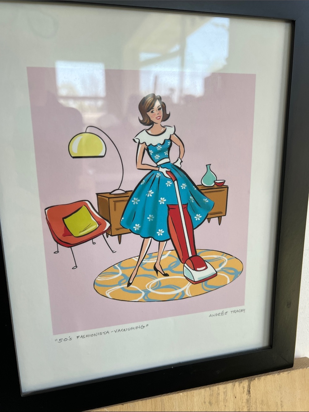 Andrée Tracey '50s Fashionista Vacuuming' Retro Home Art Print - Blue